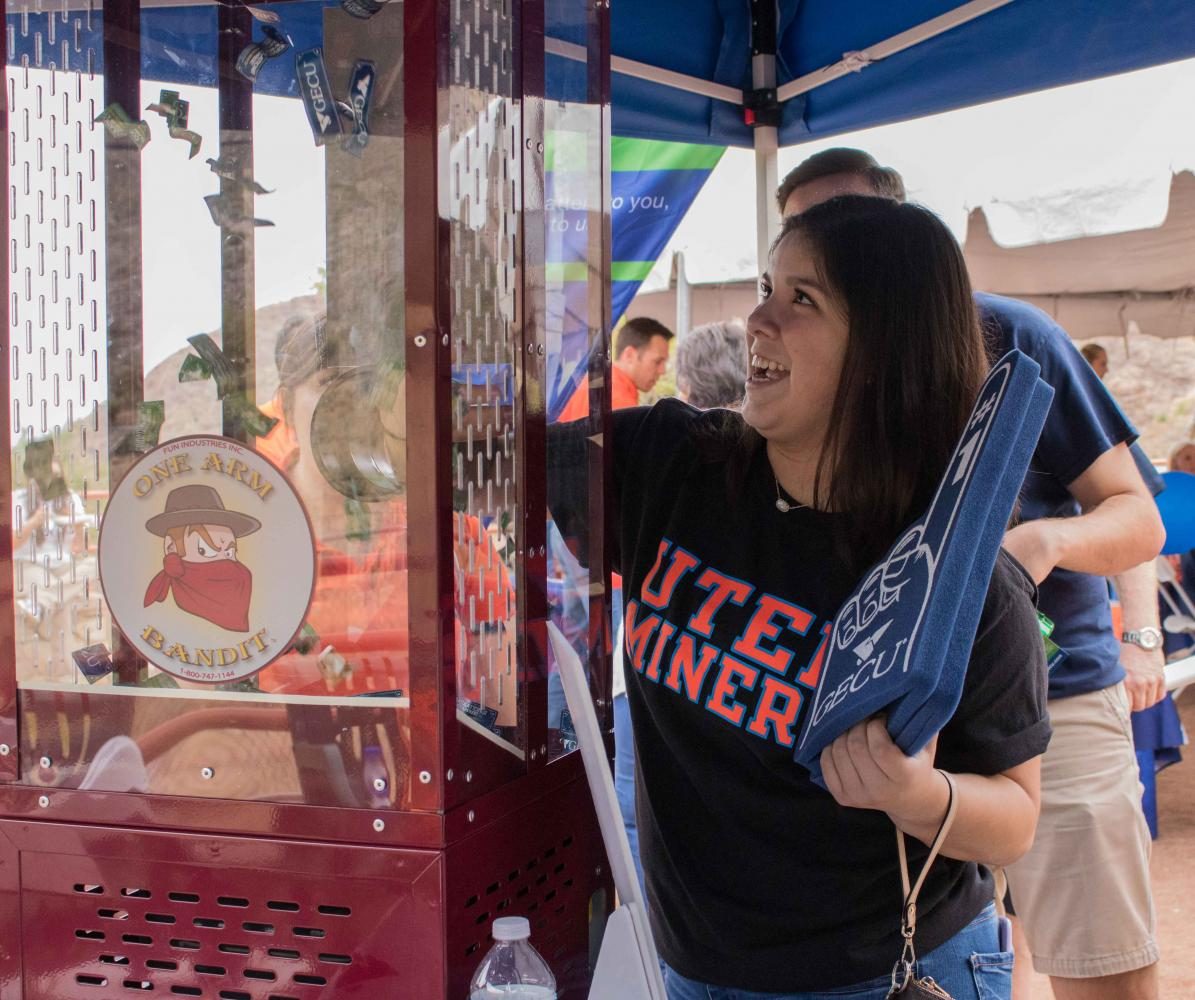 UTEP Alumni family member Monica Espinosa tried her luck a the one arm bandit