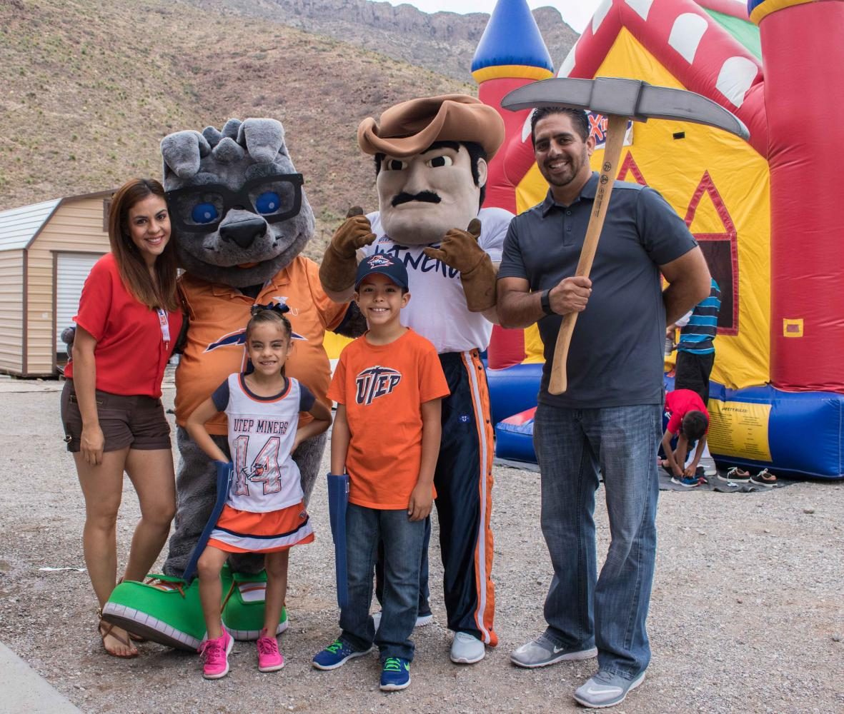 Alumni members and family posed with UTEP mascots during 