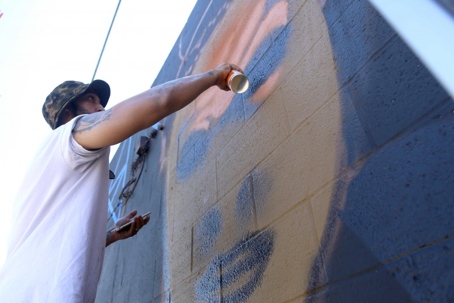 Collaborative group paints Transfiguration mural