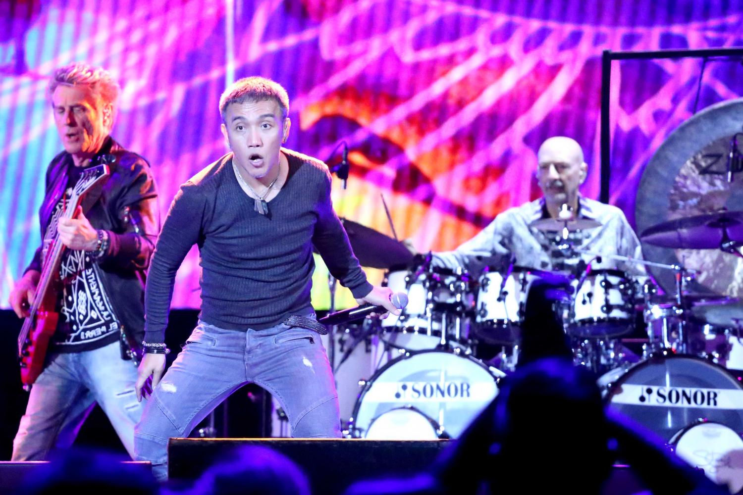 Journeys lead singer Arnel Campaner Pineda performs along with the band at the UTEP Don Haskins Center on Wednesday, July 19. 