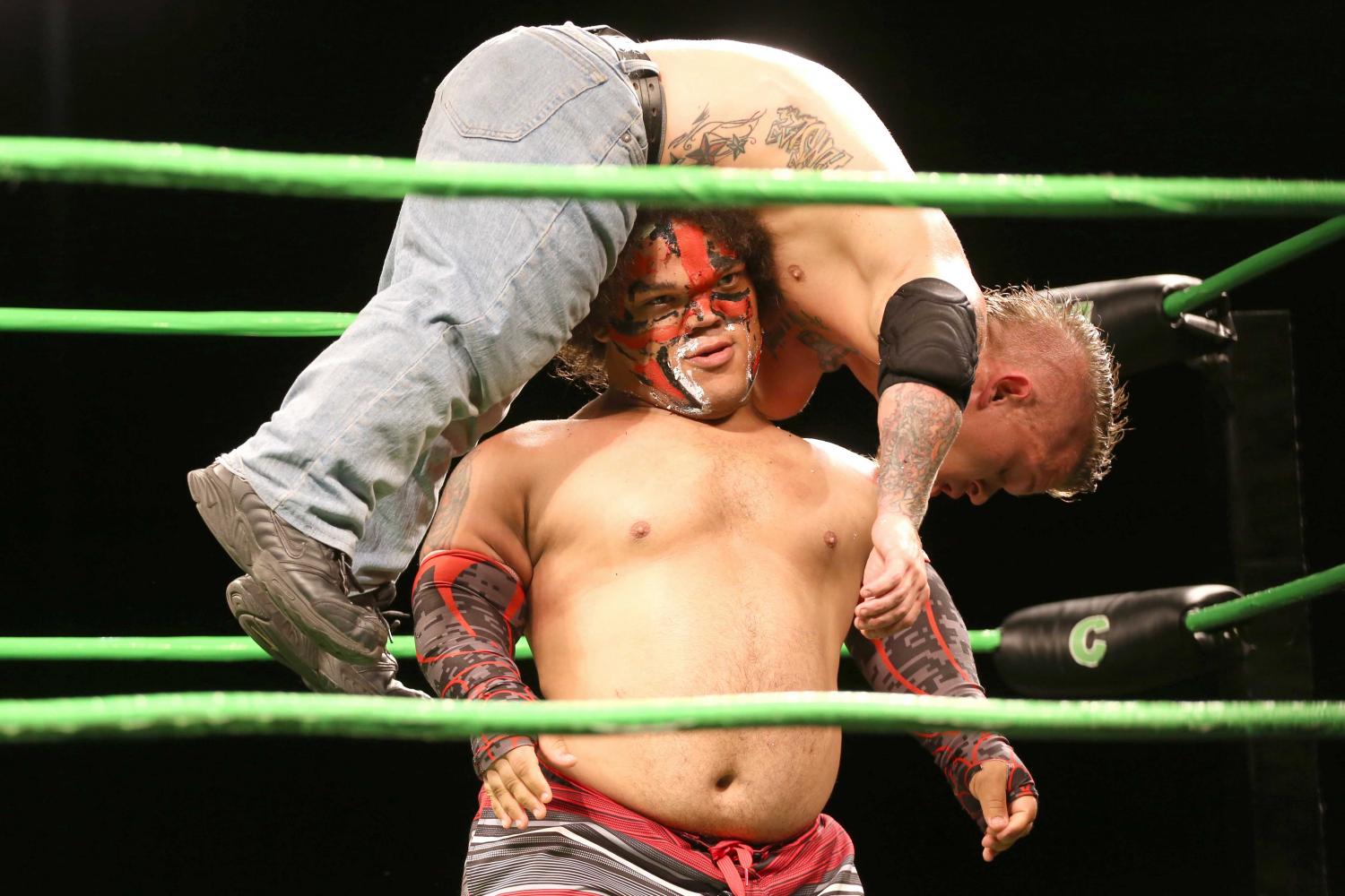 King Samoa carrying MCW champion Cowboy Kid Quick on his head.