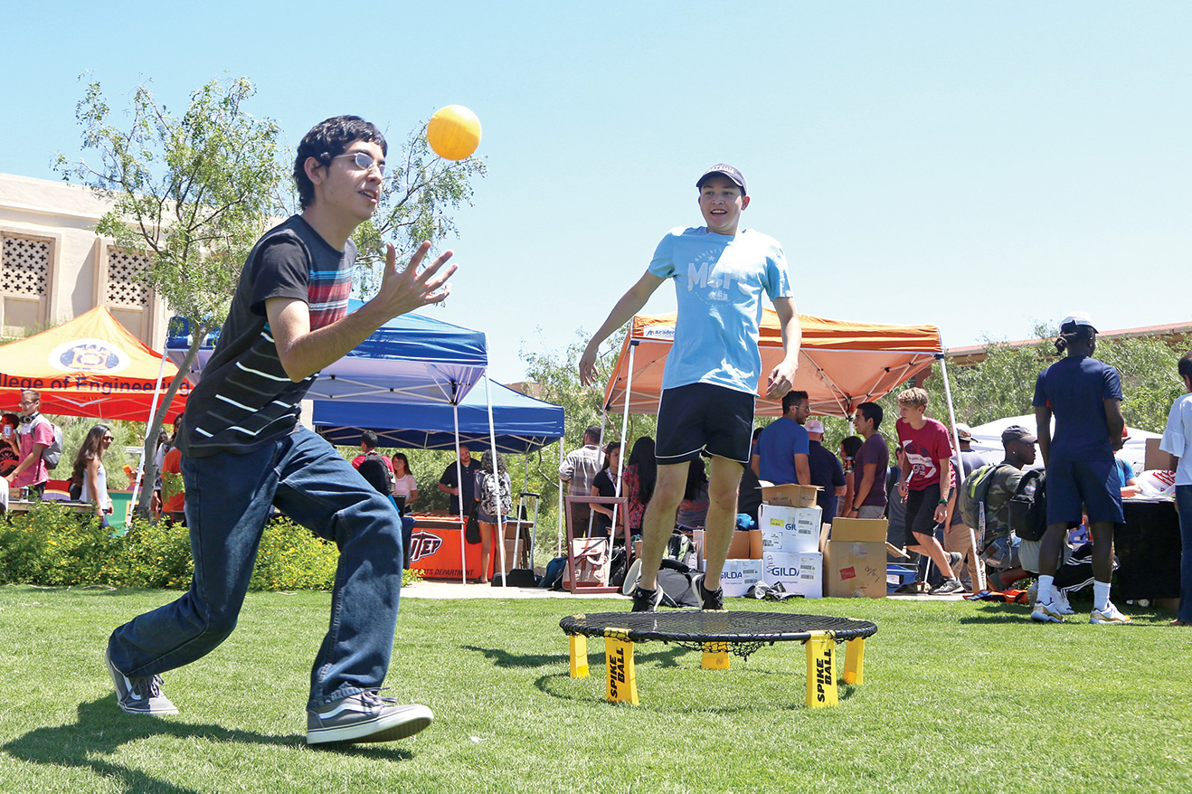 Junior finance major Eric Barron and sophomore materials and metallurgy major Daniel Morales play spike ball at Centennial Plaza in between classes on the first day back to school.