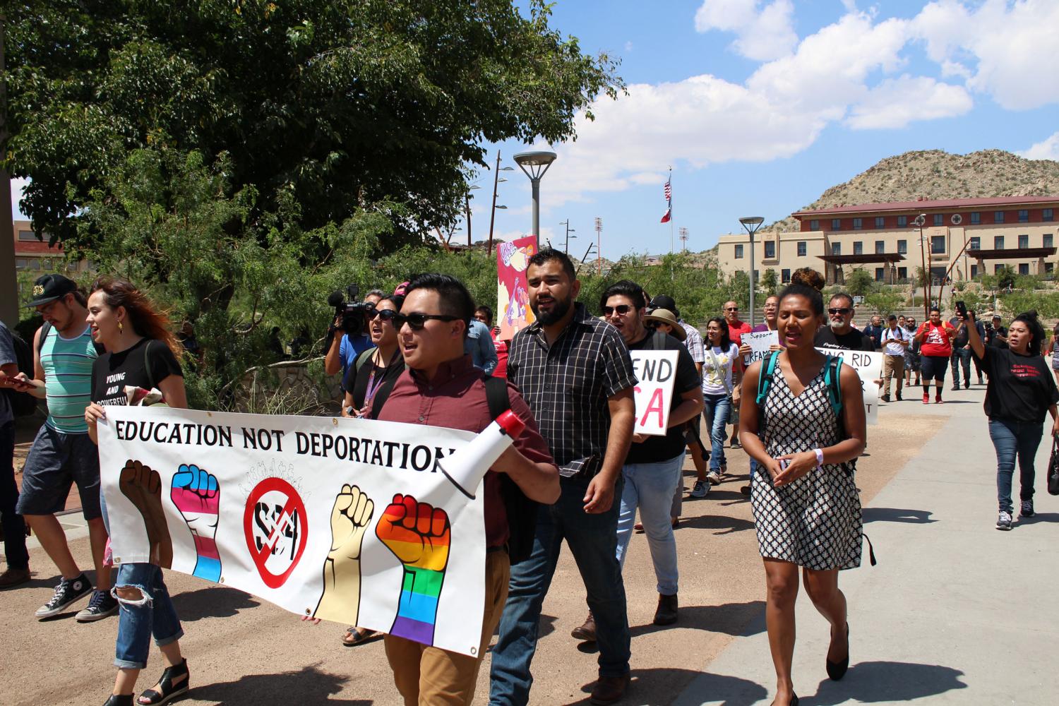 Protestors march to Natalicios office. 