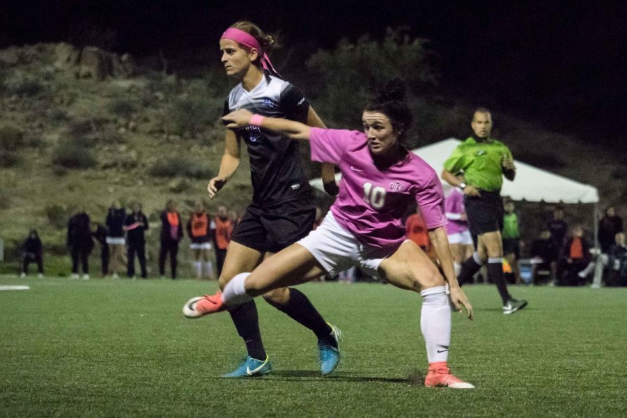 UTEP womens soccer player Vic Bohdan lunges forward after stealing away the ball from Middle Tennessee.