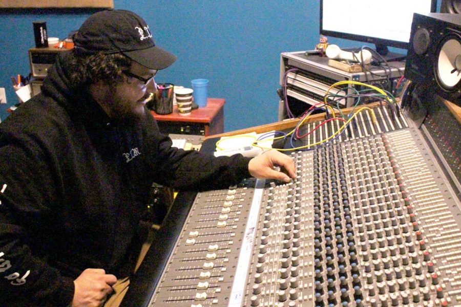 Sound engineer Sebastian Estrada mixing and mastering a recording at Brainville.