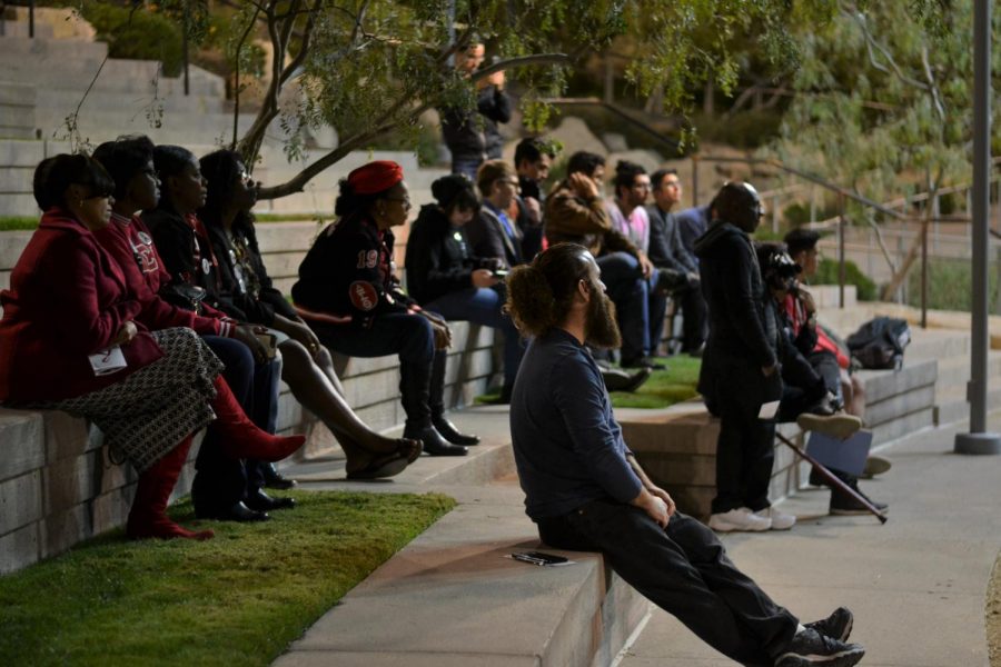 Students at Centennial Plaza gathered on Thursday night to celebrate the vigil for World Aids Day.
