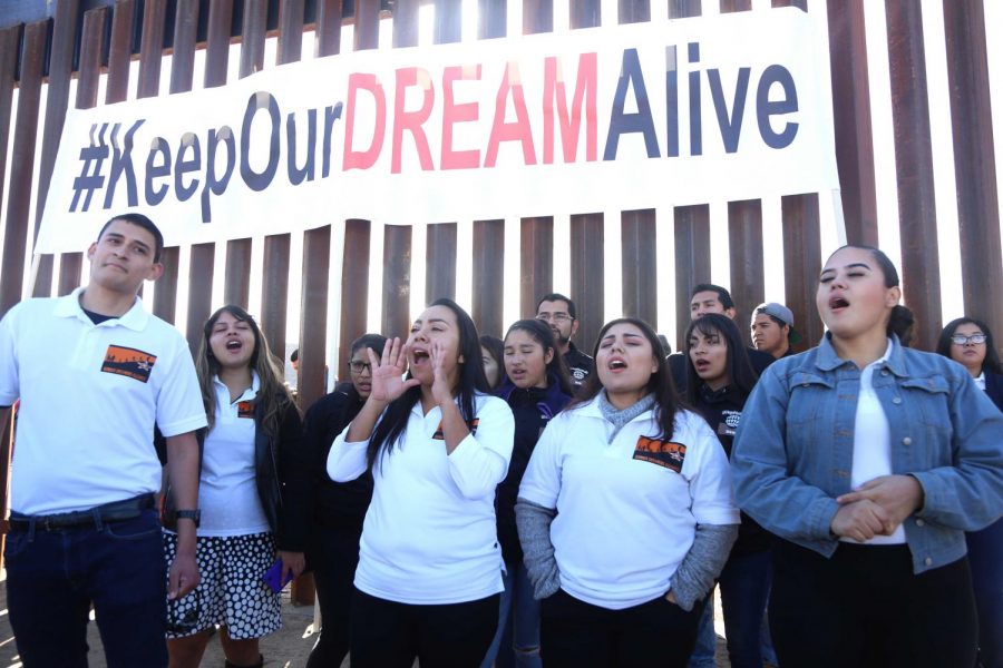 The Border Dreamers Alliance chant along the dreamers on the other side of the fence that were deported on Sunday, Dec. 10, 2017