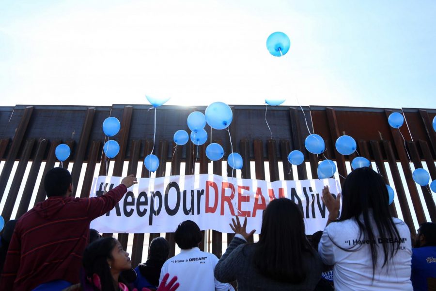 Families release blue balloons that symbolize that the walls werent going to destroy the union between the families on Sunday, Dec. 10, 2017.