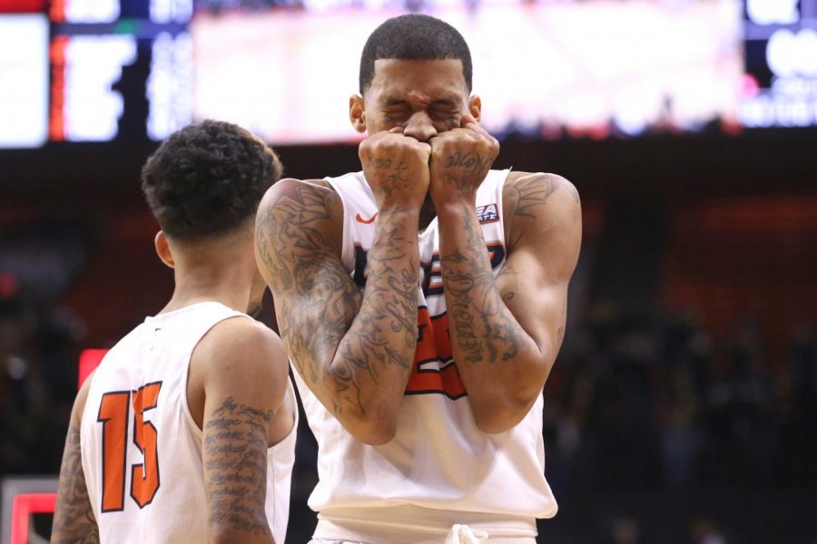 Keith Frazier covers his mouth after Paul Thomas missed a game winning shot. 