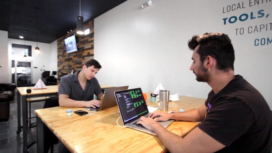 Bean Parabeac  co-founders work on their app at the CoWork Oasis offices. 