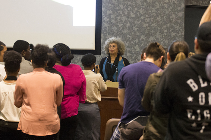 Attendees of Angela Davis lecture, at UGLC on Wednesday, Feb. 7, welcome her with a standing ovation. 