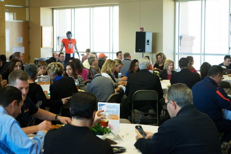 Media members, coaches families, and attendees enjoy a lunch on UTEPs annual signing day luncheon at the Larry K. Durham Center.