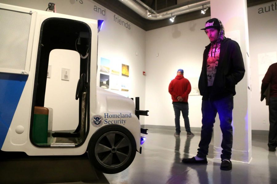 DoART student observes the piece of visiting Assistant Professor of sculpture Angel Cabrales. 