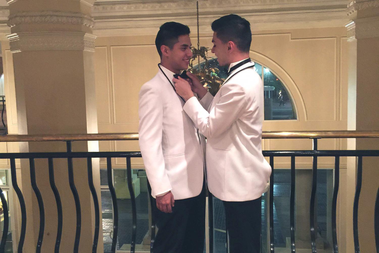 Damian Padilla adjusts his boyfriend Angel Garcia’s bow tie. The two met during high school and they have been together since.
