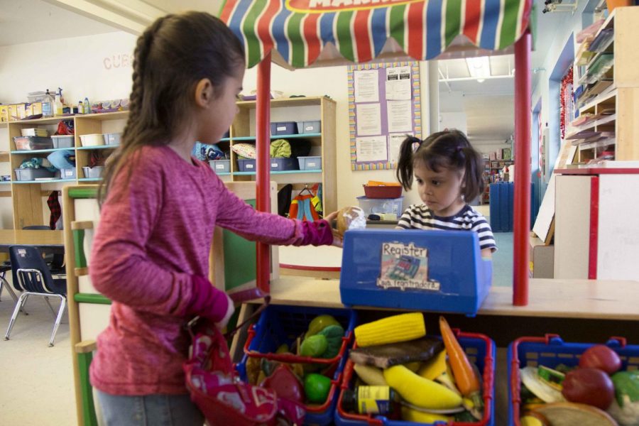 Two sisters, Lexie Rangel and Addison Rangel, play at the YWCA.