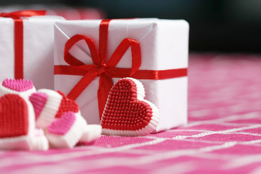 valentine gift box surrounded with candy hearts.