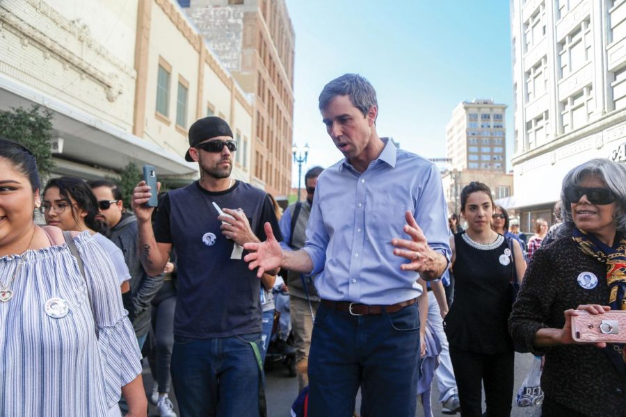 Beto O’Rourke talks to his supporters as he walks from his town hall at San Jacinto Plaza to the El Paso County Courthouse, where he voted on the last day of early voting, Friday, March 2. 