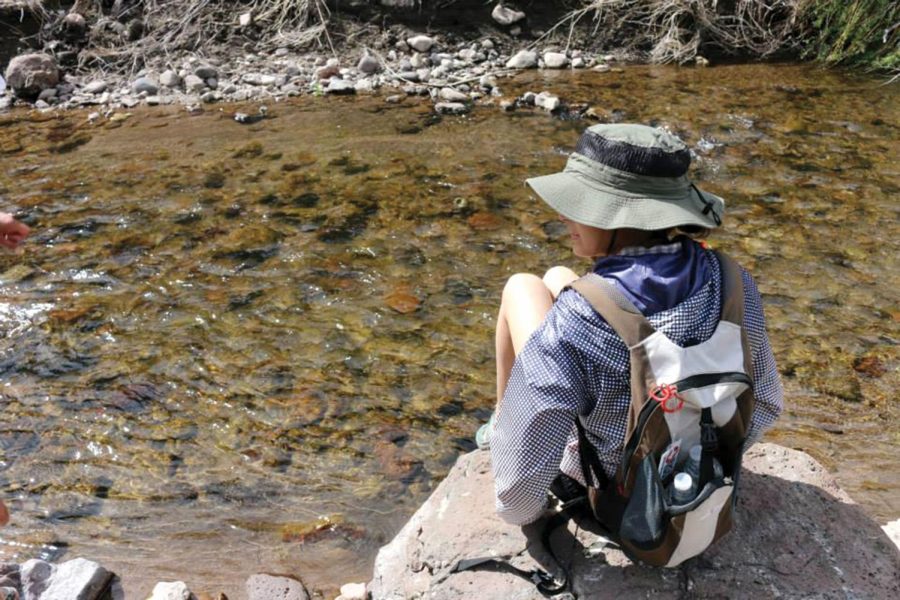 Former UTEP Student Jessica Mendez sits on a rock near Truth Or Consequences, New Mexico. T or C is best known for its hot springs and only two hours outside of El Paso. 