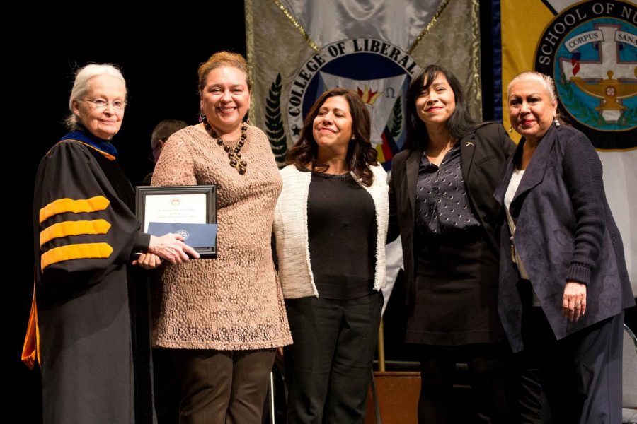 (From left to right) President Diana Natalicio presents Guillermina Nuñez- Muchiri, Areli Chacón, Cynthia Marentes and Liz Chavez with UTEP’s Outstanding Team Service Award on Feb. 28 at Magoffin auditorium.