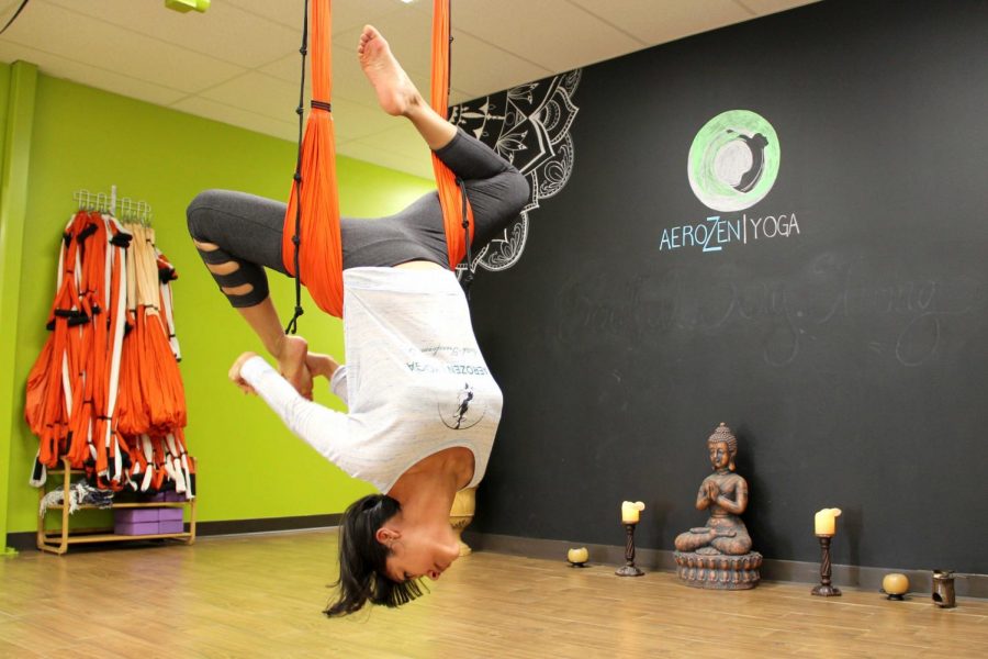 Instructor and owner of AeroZen Yoga Nahsyelli Elena Hernandez demonstrates the advanced techniques used during AeroYoga class at the studio located in 10110 Montwood Drive  