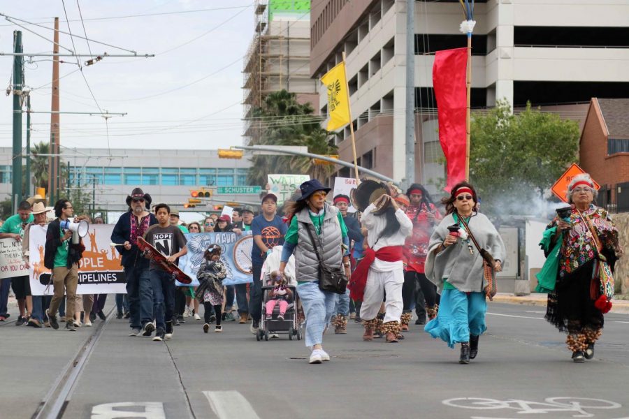 Marchers+head+down+Oregon+St.+from+Centennial+Plaza+on+Sunday%2C+April+22+for+the+March+for+Planet+Earth.