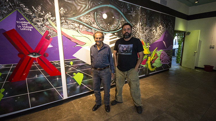 Left) Don Shapiro and Valentin Sandoval stand in front of a Los Visionaries mural at Power at the Pass. The two have partnered to start Power at the Pass, a center for artists to cultivate ideas and work on multimedia projects.  