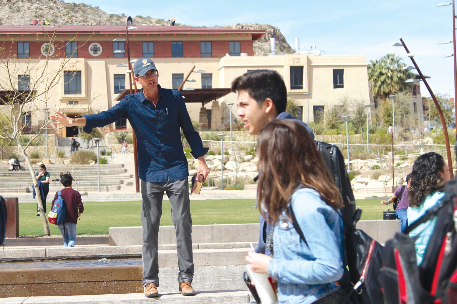 Ryan Denton, also known as “Preacher guy,” holds his Bible at Centennial Plaza in his routine spot. The 32-year-old is a non-degree seeking student at UTEP.