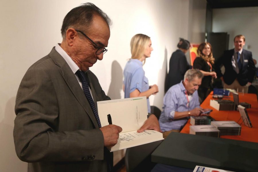Mexico border correspondent for the Dallas Morning News Alfredo Corchado signs his newest book “Homelands: Four Friends, Two Countries, and the Fate of the Great Mexican-American Migration” before the panel discussion on Thursday, June 7 at the Union. 