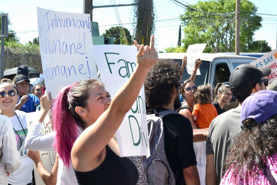 Protestor shows her displeasure with Trumps immigration policies.  