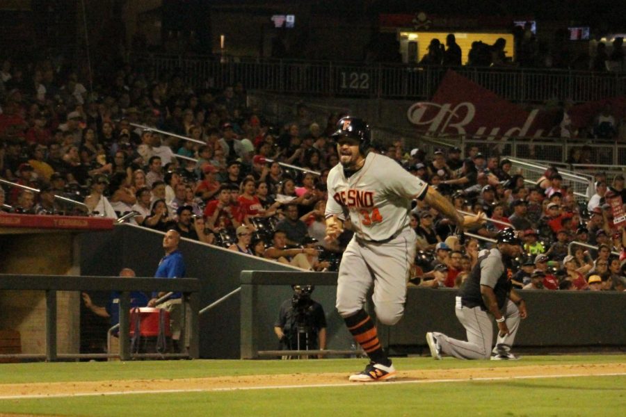 Nick Tanielu runs towards home base.