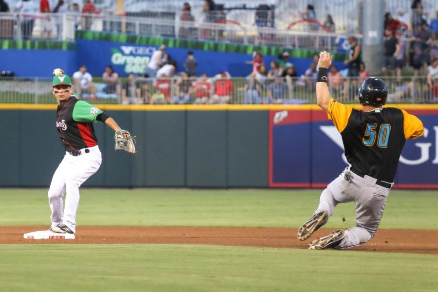 Los+Chihuahuas+second+basemen+Luis+Urias+gets+Los+Dorados+first+basemen+Jerry+Sands+out+at+second+base+and+attempts+a+double+play.+