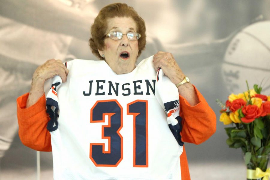 Katie Jensen reacts to the custom-made football jersey that Athletic Director Jim Senter gave her. 