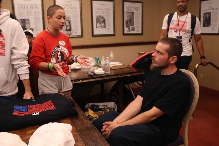 Activist Emma Gonzalez speaks with counter protestor outside of the panel discussion. 