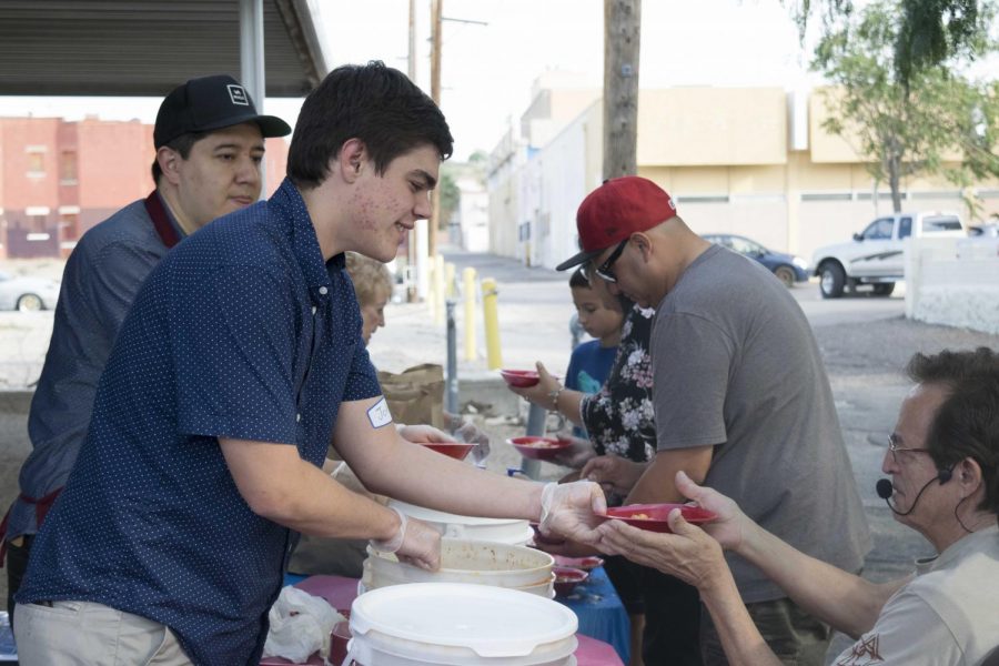 Volunteers help distribute complimentary menudo before Congressmen Beto O Rourke speaks.