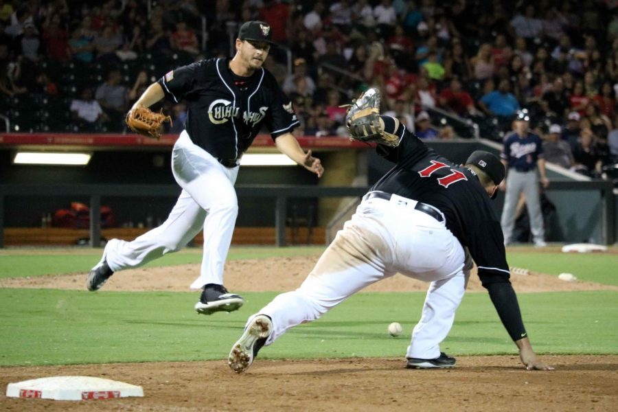 First basemen Allen Craig runs after the ball to attempt to make a defensive play.