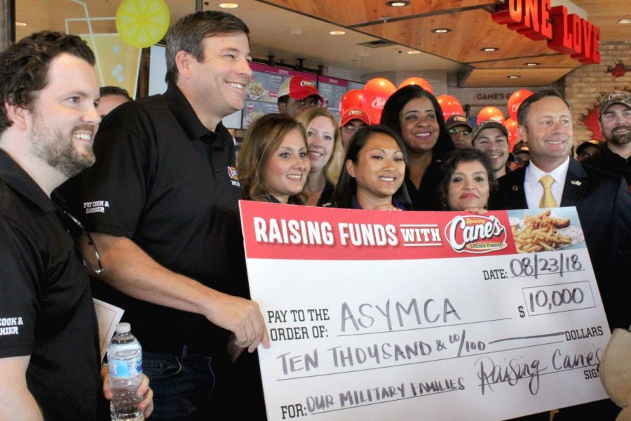 Raising Canes supports the community by awarding Army Services YMCA with a $10,000 check.  
