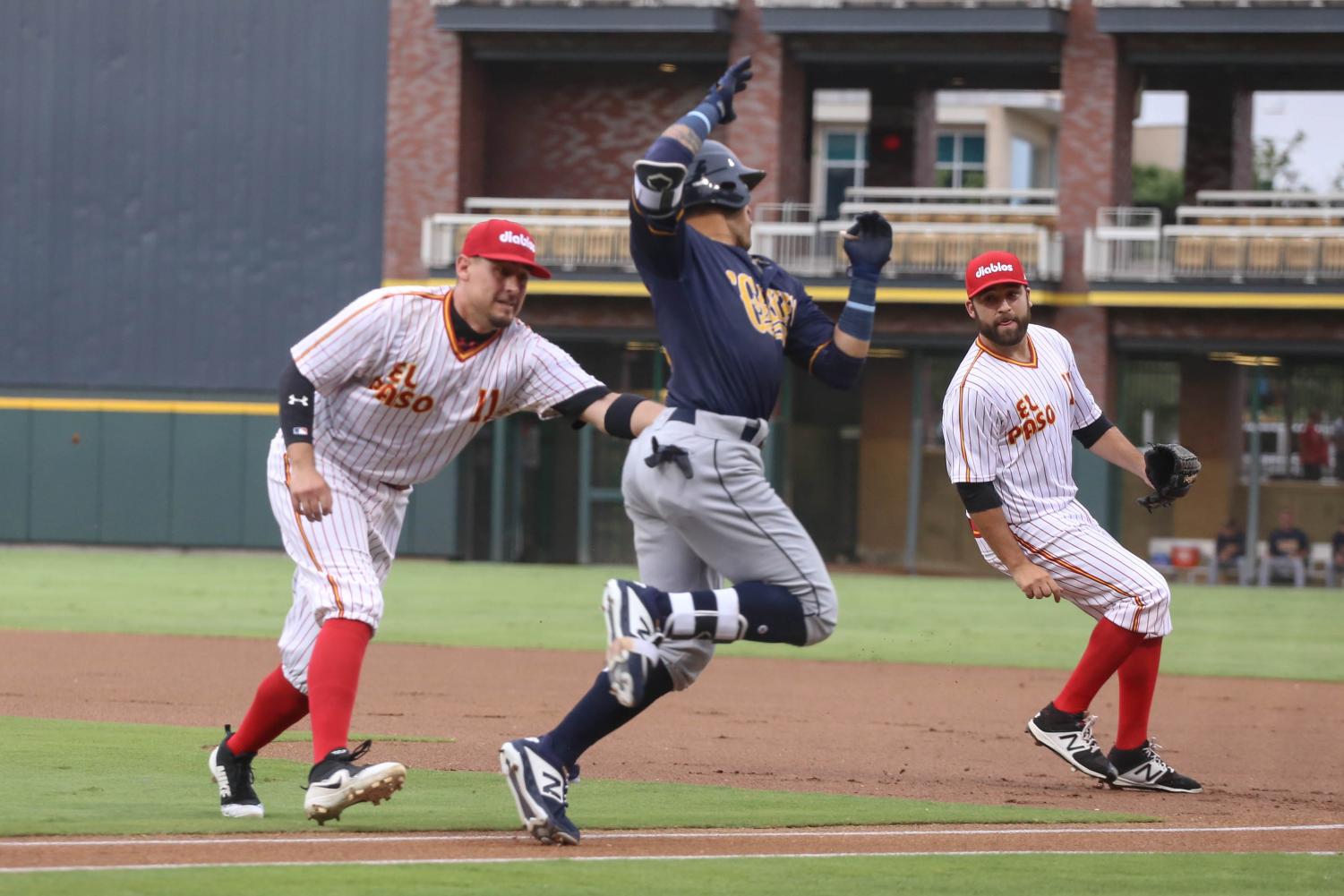 El Paso Diablos first basemen Allen Craig gets New Orleans Baby Cakes second basemen Isn Diaz out at first at game one of the series.