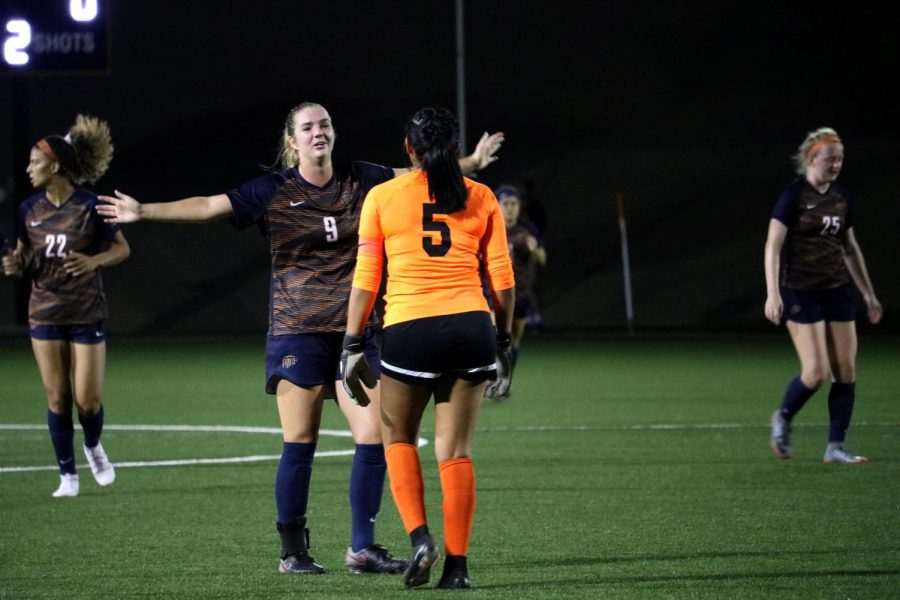 Defender Senior Payton Ross and Senior goalkeeper Alyssa Palacios celebrate their fourth goal against their opponent.