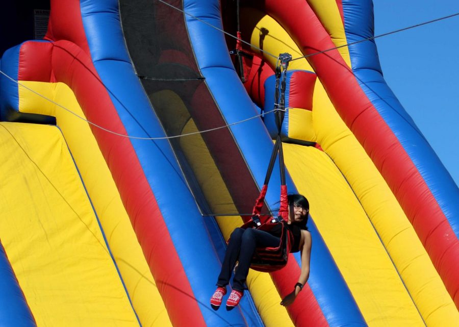 Sophomore fine arts major Sara Castro rides down the zip line.