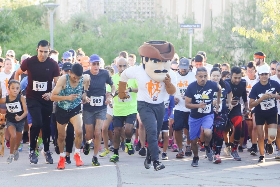 Paydirt Pete starts off the 9th Annual Miner Dash race with the 320 participants. 