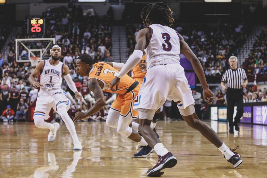 Sophomore guard Evan Gilyard attempts to avoid the defender as he finished with 25 points at the battle of I-10. 