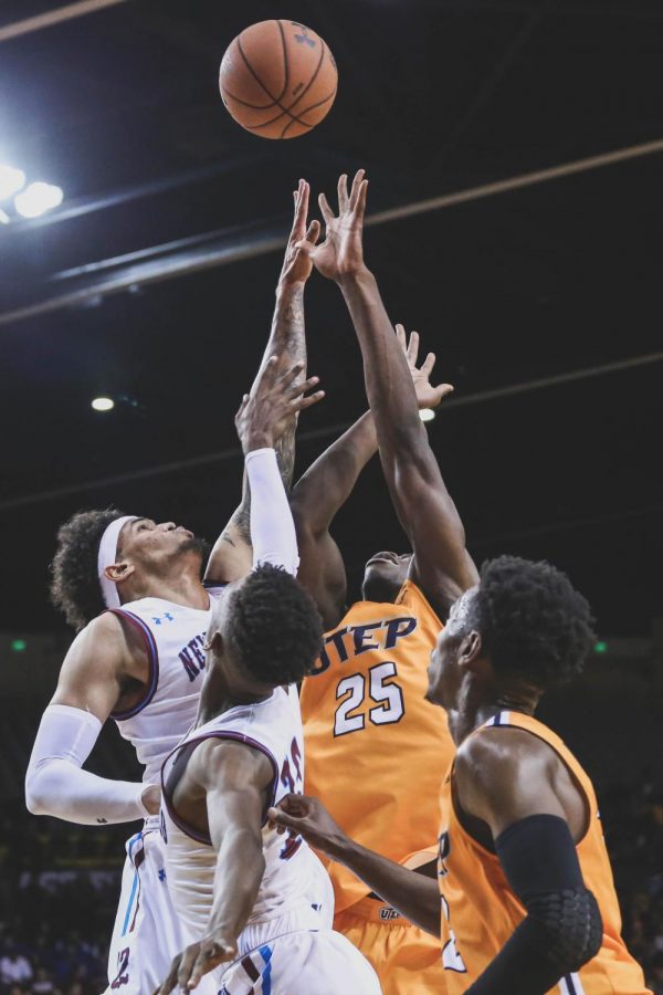 reshman forward Kasoci Ezeagu  attempst to get the rebound before NMSU. 