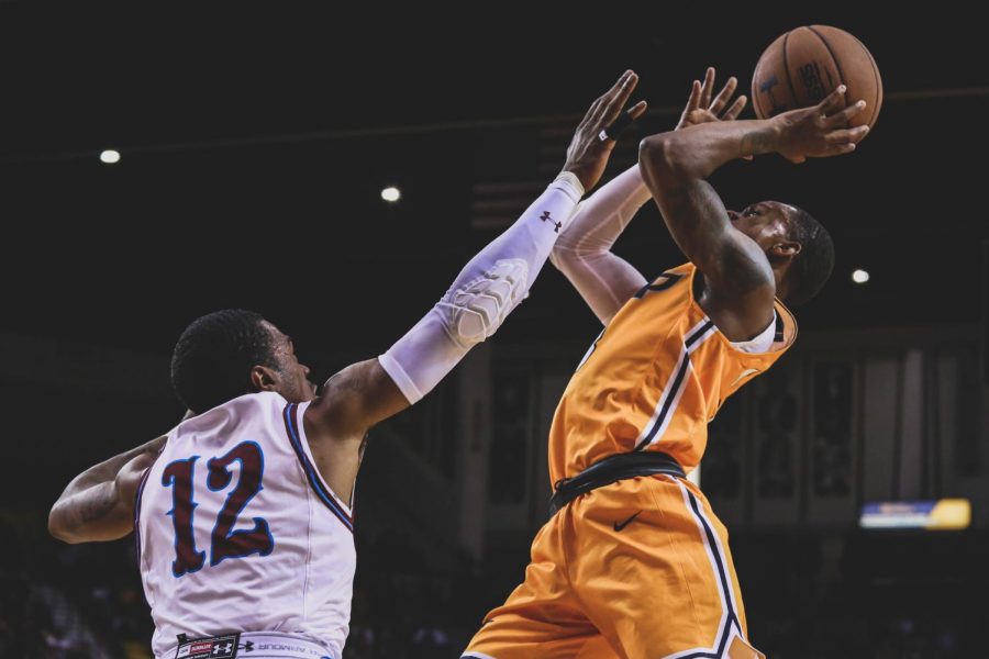 Sophomore guard Evan Gilyard  shoots the ball above his defender finished with 25 points at the Battle of I-10. 