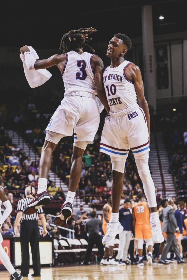 NMSU celebrate as they beat the Miners 91-66 at the battle of I-10. 