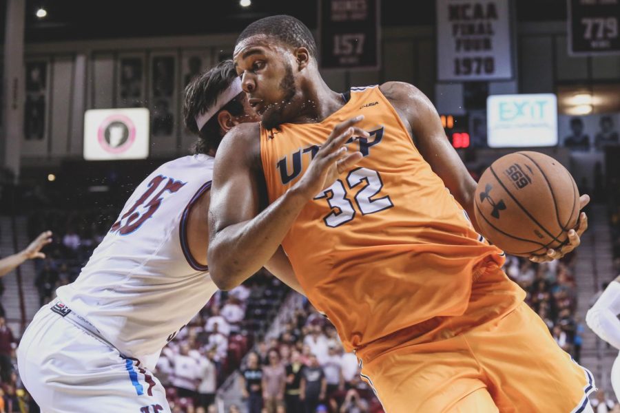 Freshman forward Efe Odigie attempts to avoid the Aggies defender at the battle of I-10. 