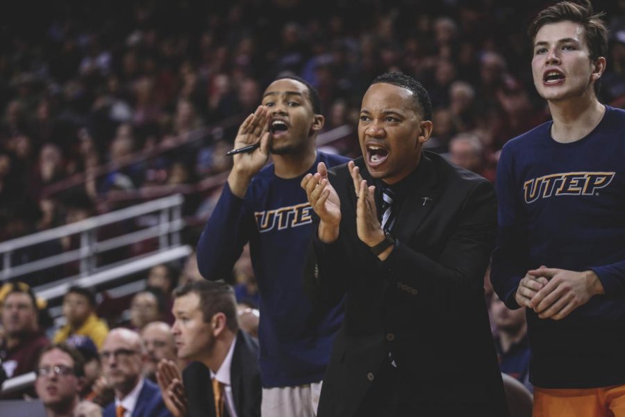 Assistant Coach Brian Burton celebrates as the Miners scored from behind the arc. 