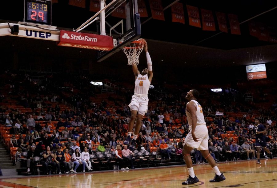 Freshman Nigel Hawkins dunks the ball on the fast break 