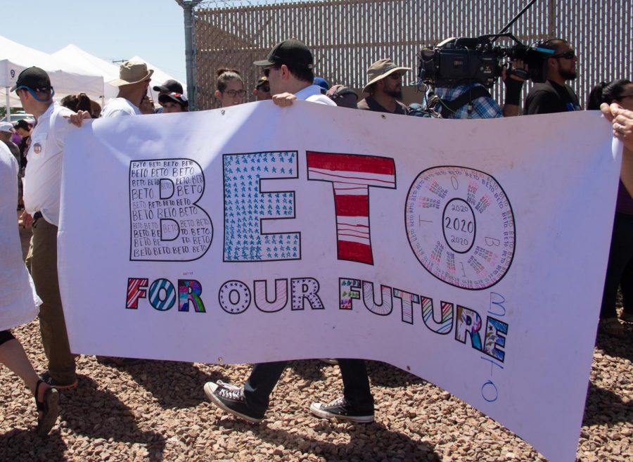 Three people hold a Beto 2020 sing at the Clint Border Patrol Station rally held by Democratic presidential candidate Beto ORourke on Sunday June 30, 2019.