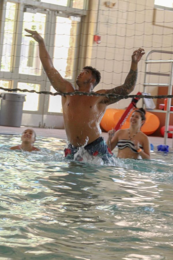 Students enjoy a game of volleyball in the pool at the 4th annual Miner Melt