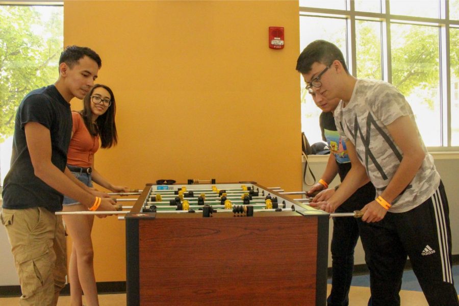 Students enjoy a game of foosball at the 4th annual Miner Melt.
